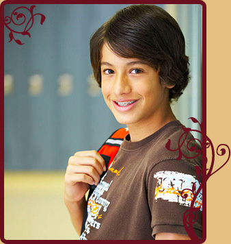 boy with braces leaning against school lockers